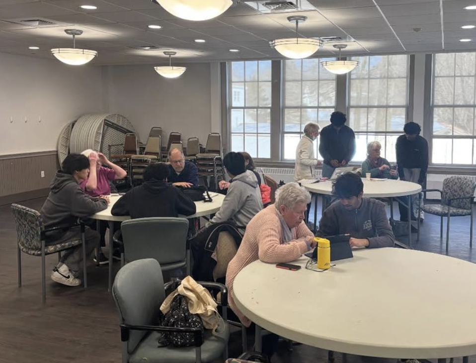 TechPals student volunteers helping seniors learn digital skills